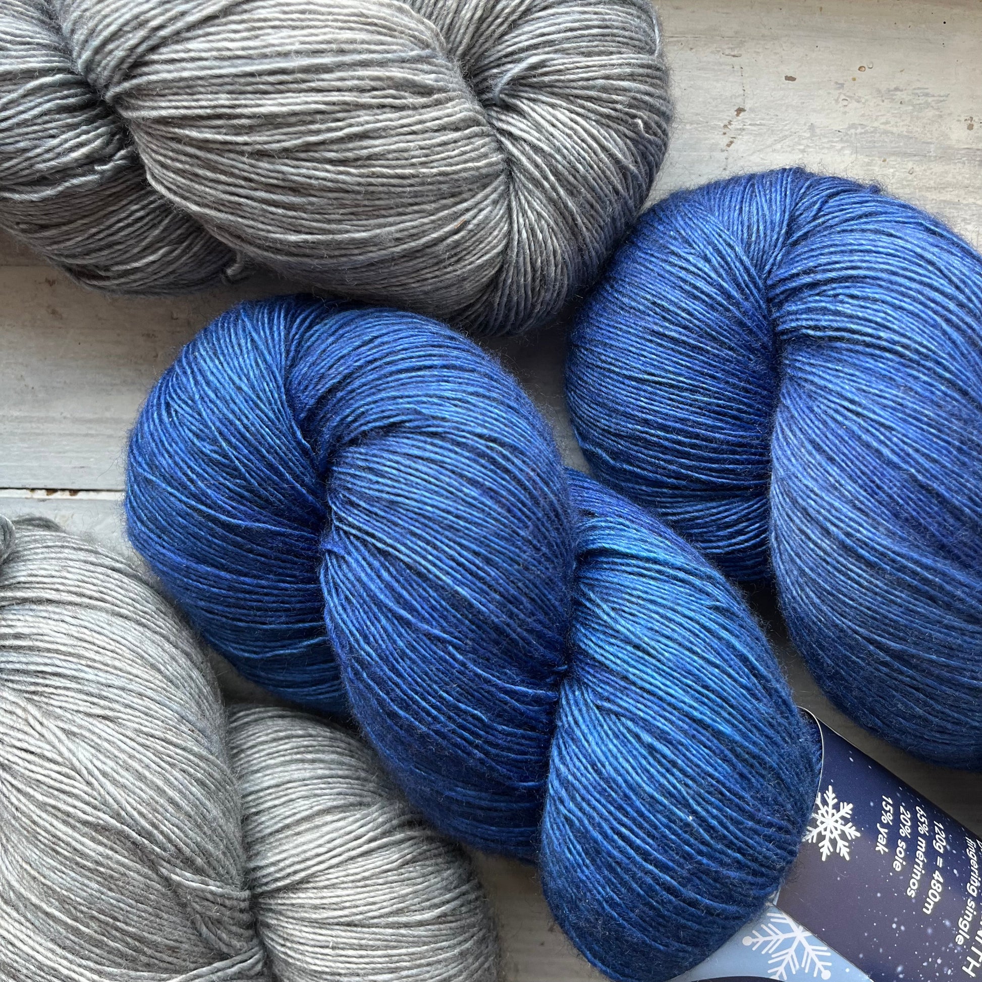 A skein of Zenith yarn in colorway Intuition - Positive Attitude which is globally multicolored