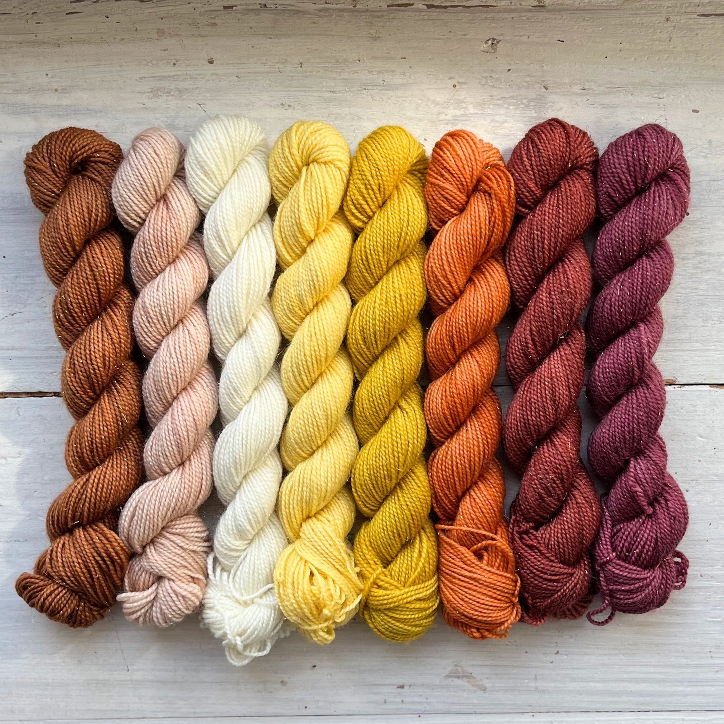 A skein of Strong & Shiny yarn weighing 20g in colorway Ajna Chakra which is globally the color purple