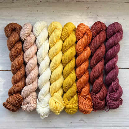 A skein of Strong & Shiny yarn weighing 20g in colorway Ajna Chakra which is globally the color purple